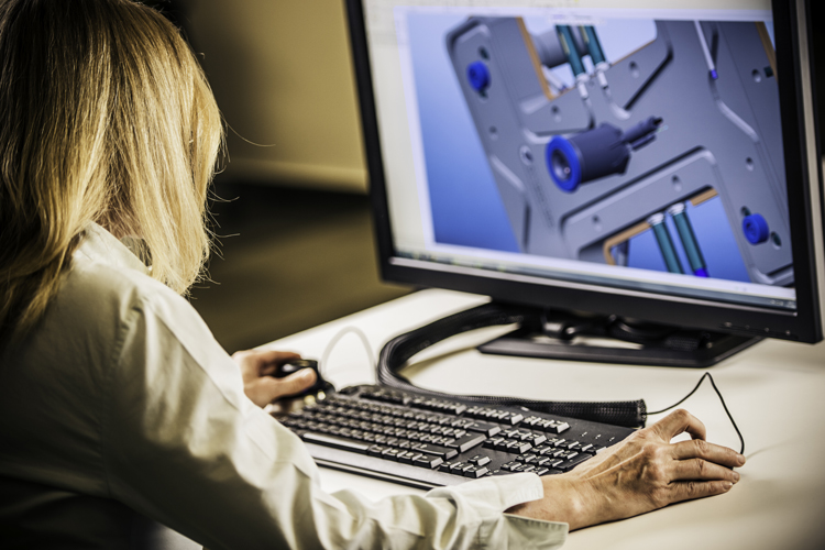 Lady at desk working with CAD model
